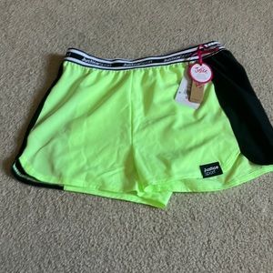 Hi I’m selling these justice green and black shorts